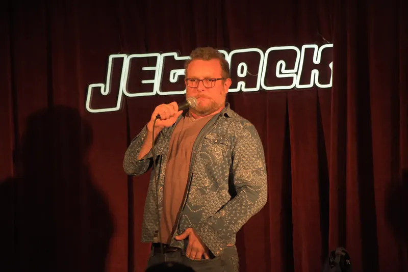 A comedian on the Jetpack stage