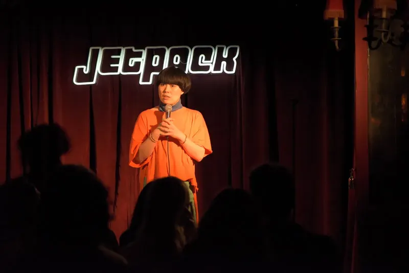 A comedian on the Jetpack stage
