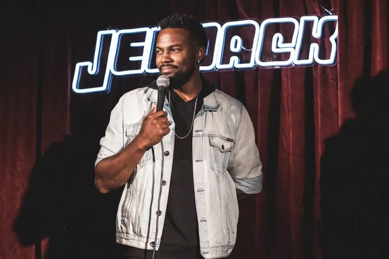 A comedian on the Jetpack stage