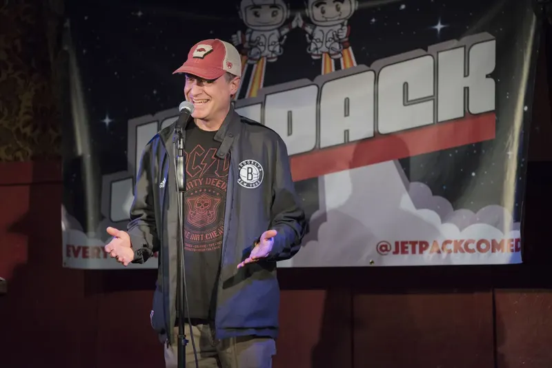 A comedian on the Jetpack stage