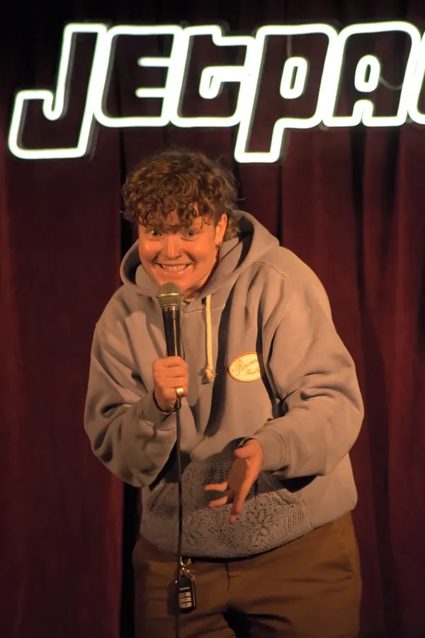 A comedian on the Jetpack stage