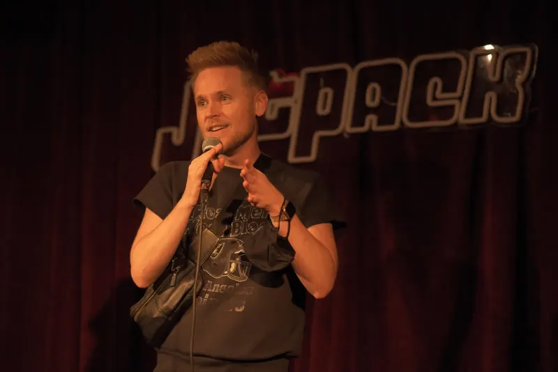 A comedian on the Jetpack stage